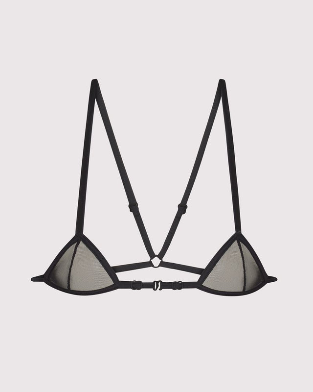 Luxury mesh micro bra on model, barely-there sheer design with adjustable straps, high-end lingerie layering piece
