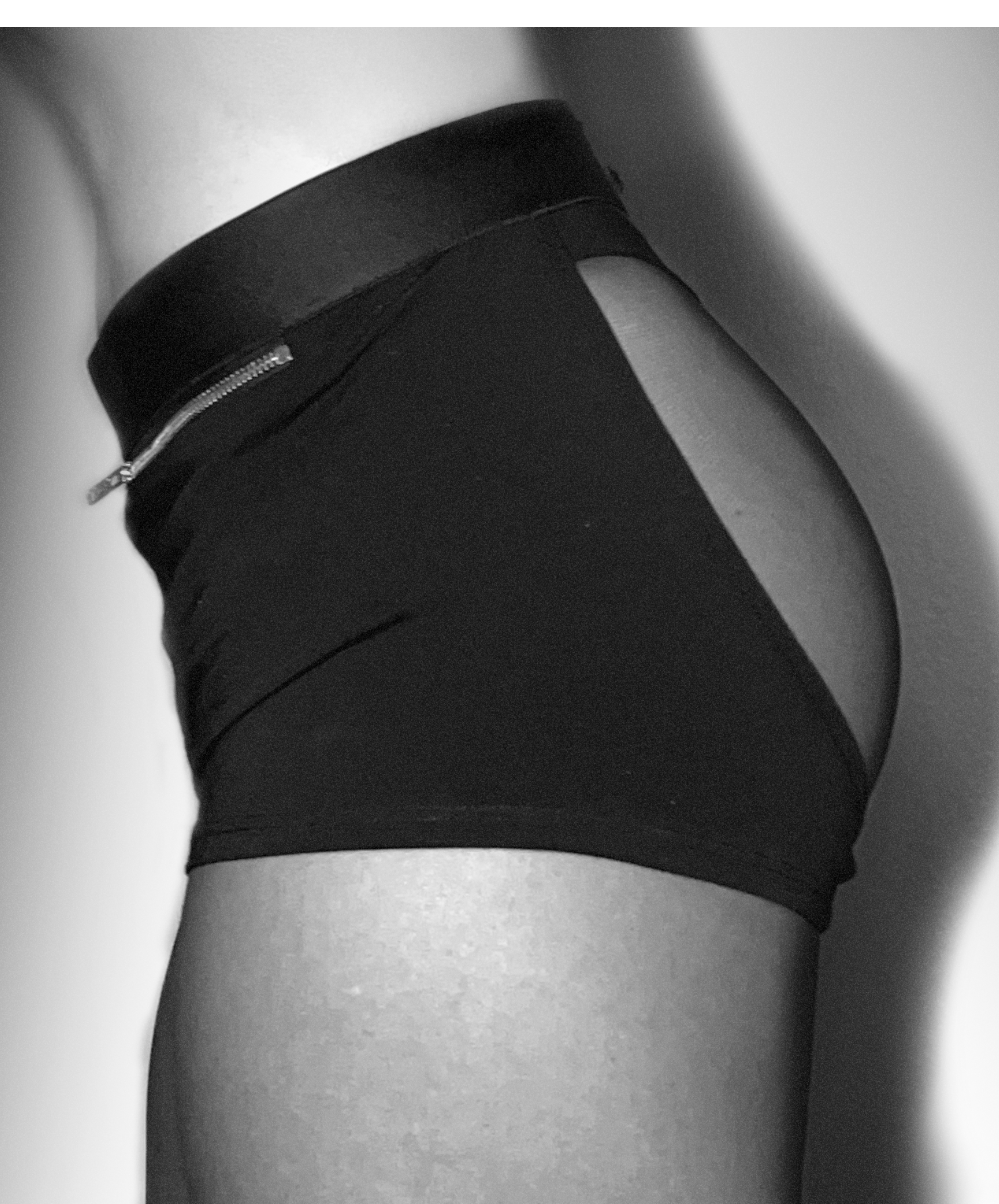 Side view close-up of Lunatic Femme Moonstruck backless boxers on model, highlighting curve-hugging fit and open-back silhouette in luxury Italian jersey