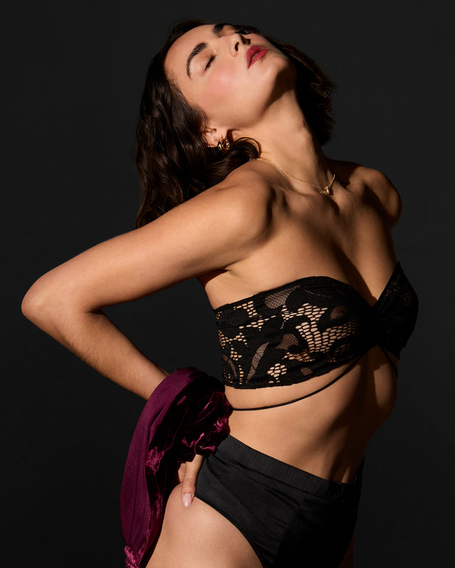 Side view of Muse Bandeau Body Band showing European lace texture and silk tie design tied around back of model. Styled with Supper Club Silk Thong and shirt for elevated lingerie dressing look

