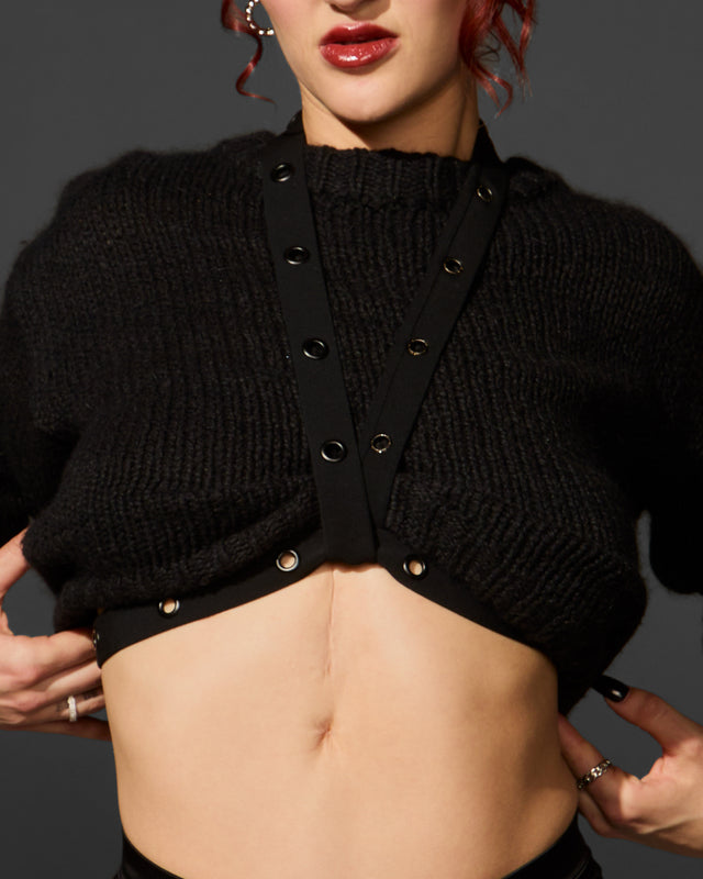 SNKX Strap styled over a sweater as a luxe body harness outfit — Lunatic Femme’s signature accessory and layering piece made in NYC.