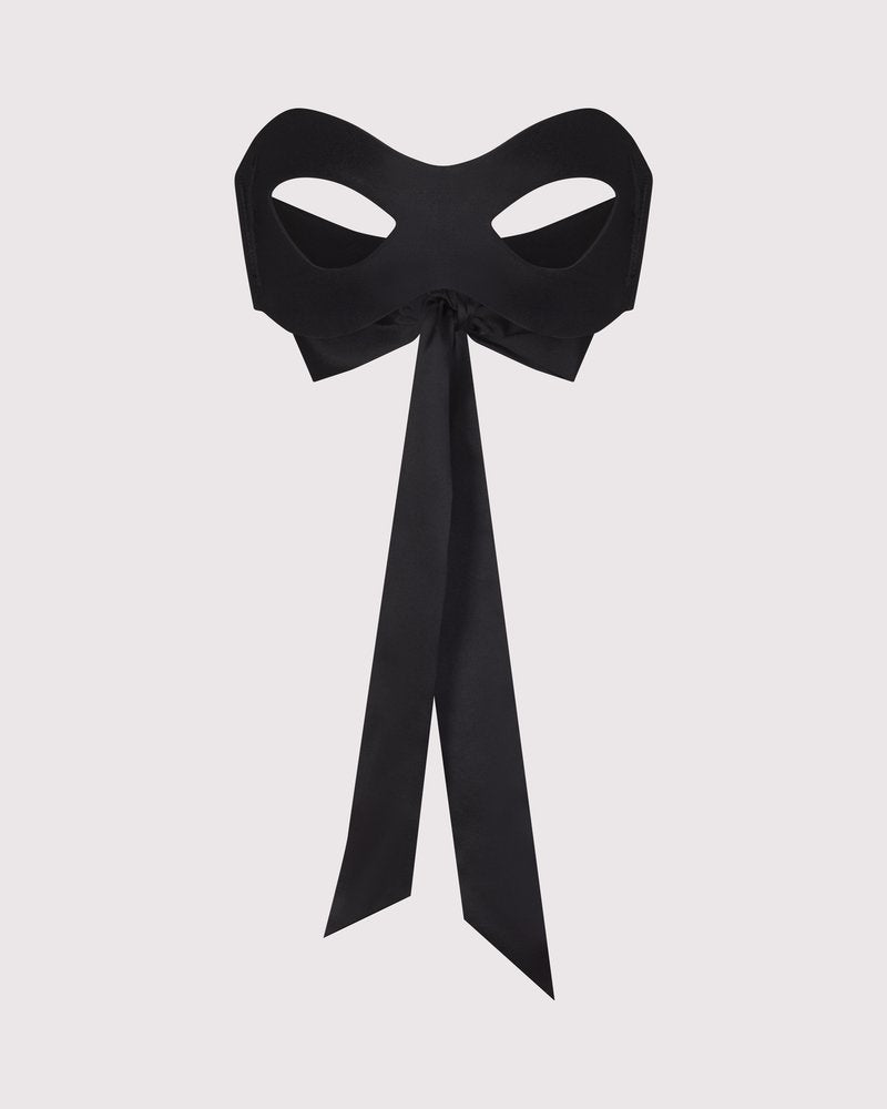 Lunatic Femme black silk blindfold mask made in NYC, shown for smooth, sensual coverage. Comes with 2 other ties for role play.
