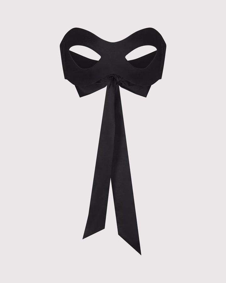 Lunatic Femme black silk blindfold mask made in NYC, shown for smooth, sensual coverage. Comes with 2 other ties for role play.
