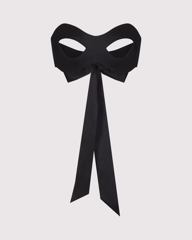 Lunatic Femme black silk blindfold mask made in NYC, shown for smooth, sensual coverage. Comes with 2 other ties for role play.
