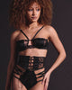 Model wearing black lace waist cincher and choker with adjustable ties